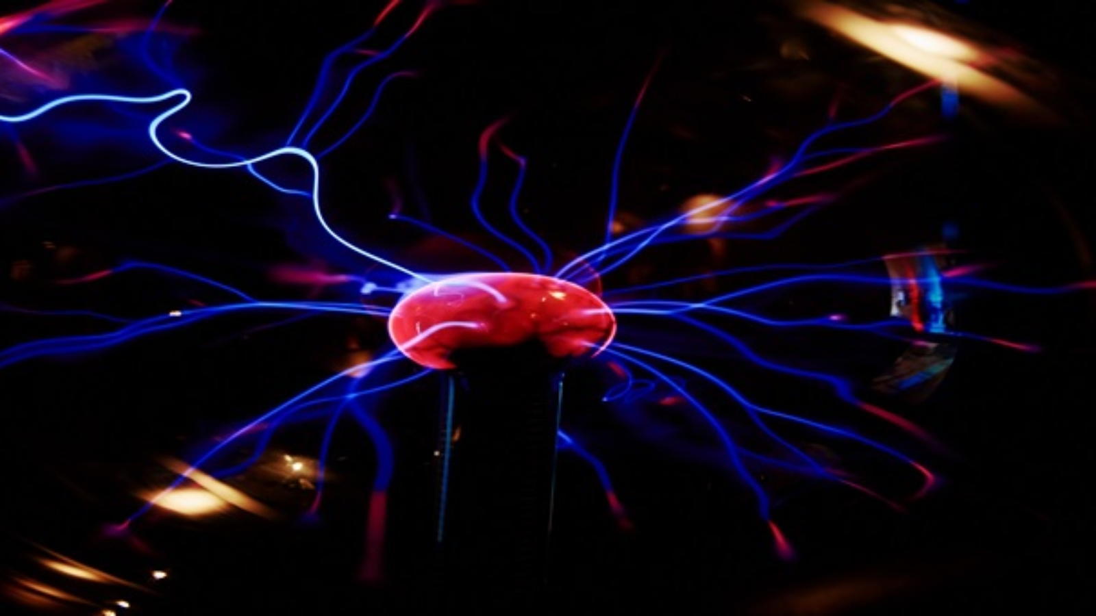 Plasma ball with energy rays on dark background, Physic model of plasma sphere
